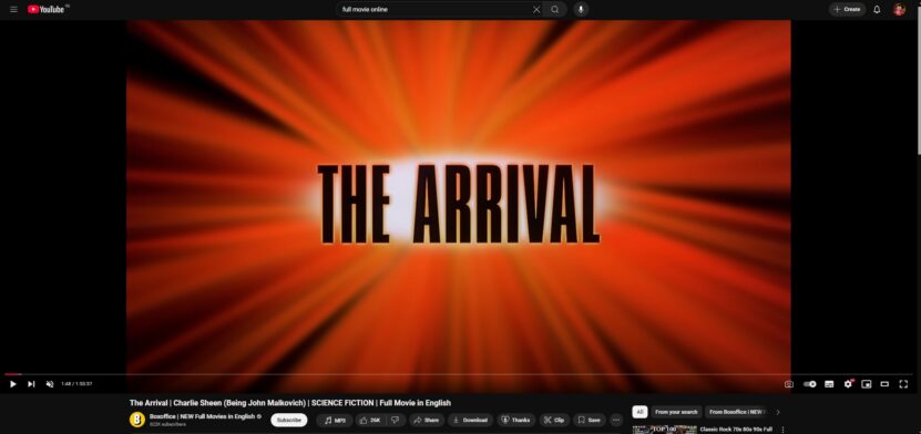 Screenshot of a YouTube video with the title 'The Arrival' in bold text on a radiant orange background, showing a movie interface